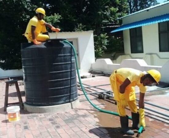 Tank cleaning services by cleaners in uniform